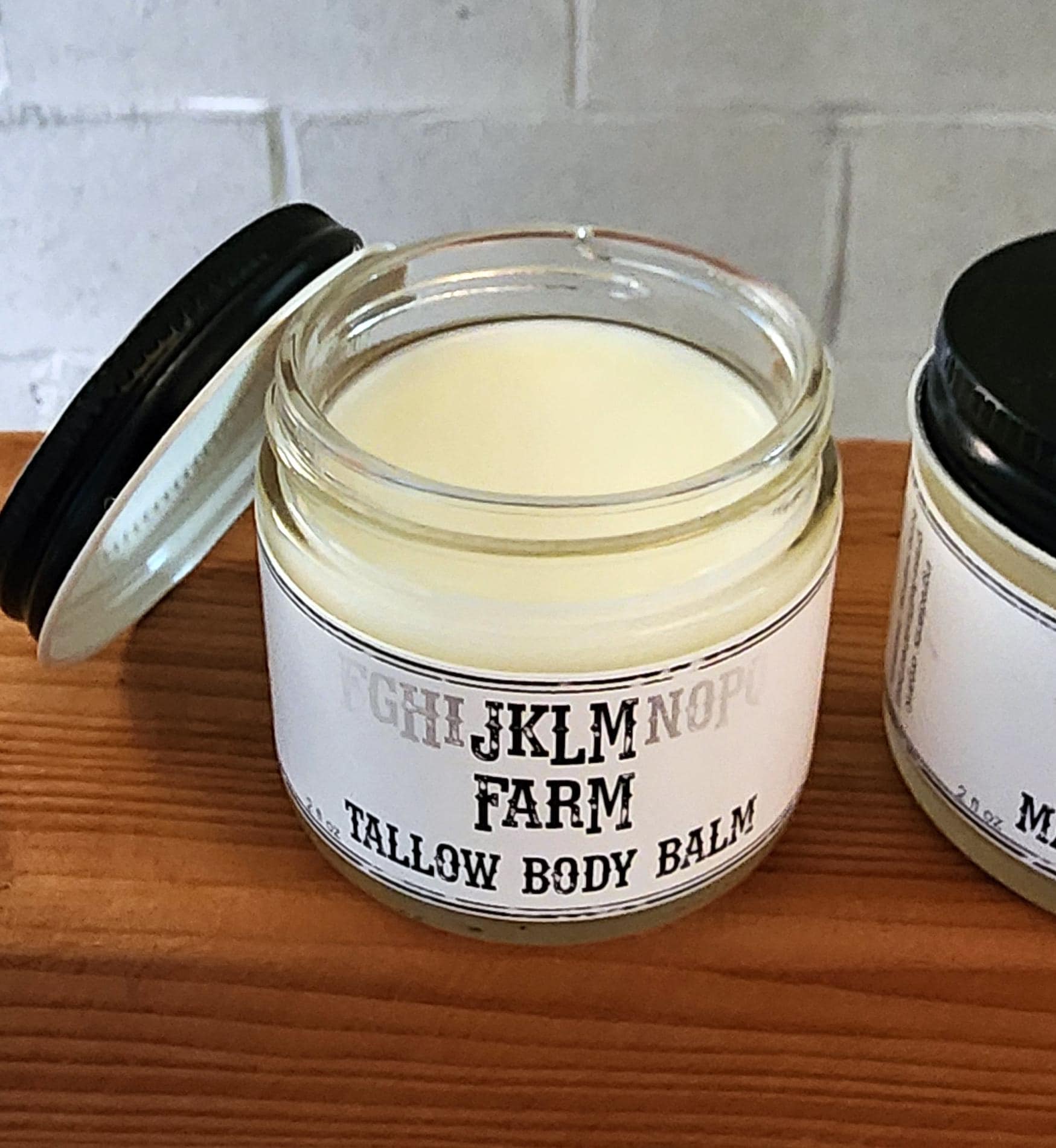 jklm farm tallow body balm without the lid to show texture